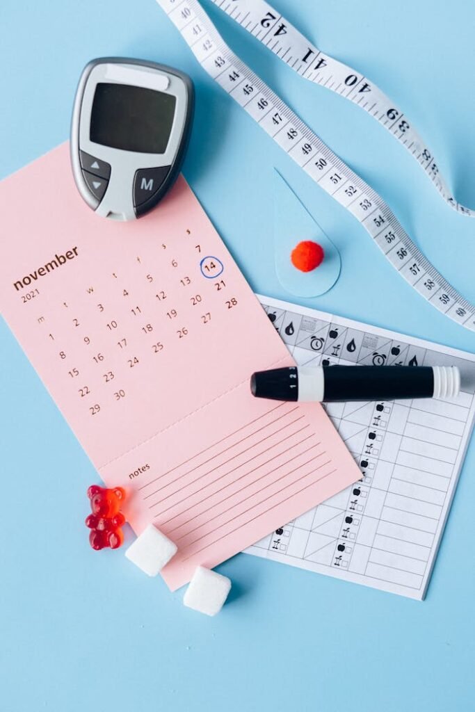 pexels-photo-6942039 Flat lay of diabetes awareness tools on a blue backdrop with calendar.